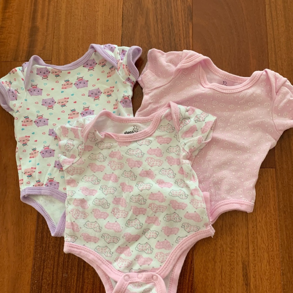 Three infant bodysuits.